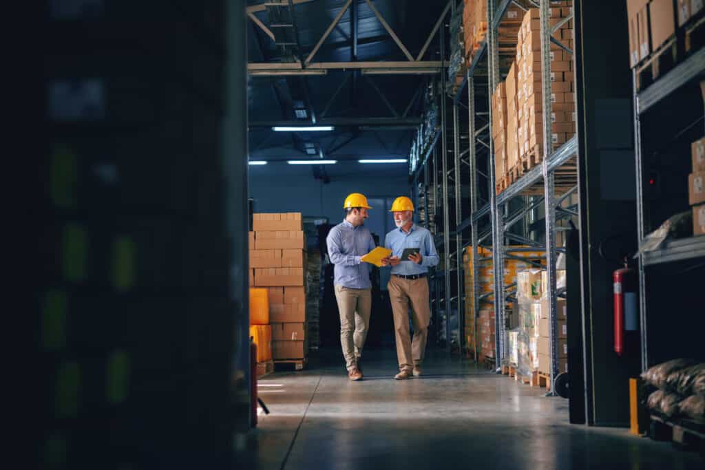 men walking around a facility to see what maintenance should be done